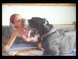 Amateur redhead offering a blowjob to her dog