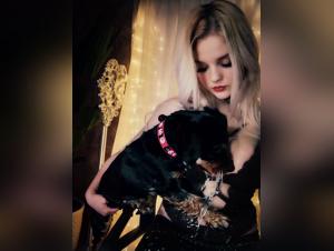 Blonde bestiality: Alina and her dog in an erotic dance