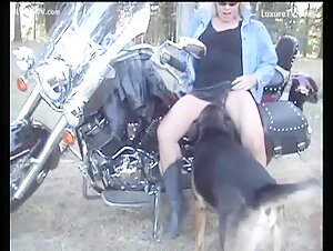 Blonde Biker and Dog Outdoors: A Bestial Encounter