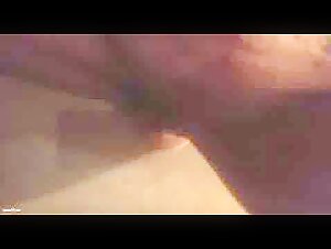 Dog licks while using a dildo