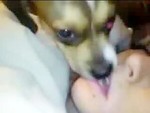 French woman shares an intimate moment with her dog