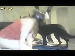 Masked woman and her dog in amateur webcam