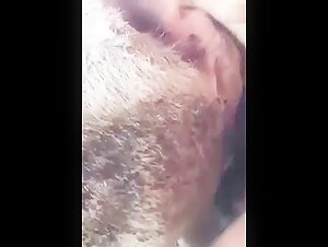 Woman and two young men with a cow