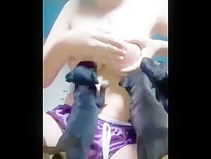 Woman breastfeeding a puppy - Bestiality video