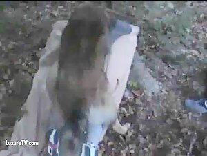 Woman offers her buttocks to a dog for a beastly encounter outdoors