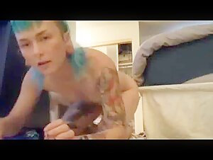 Young tattooed punk fucks with a dog and films herself